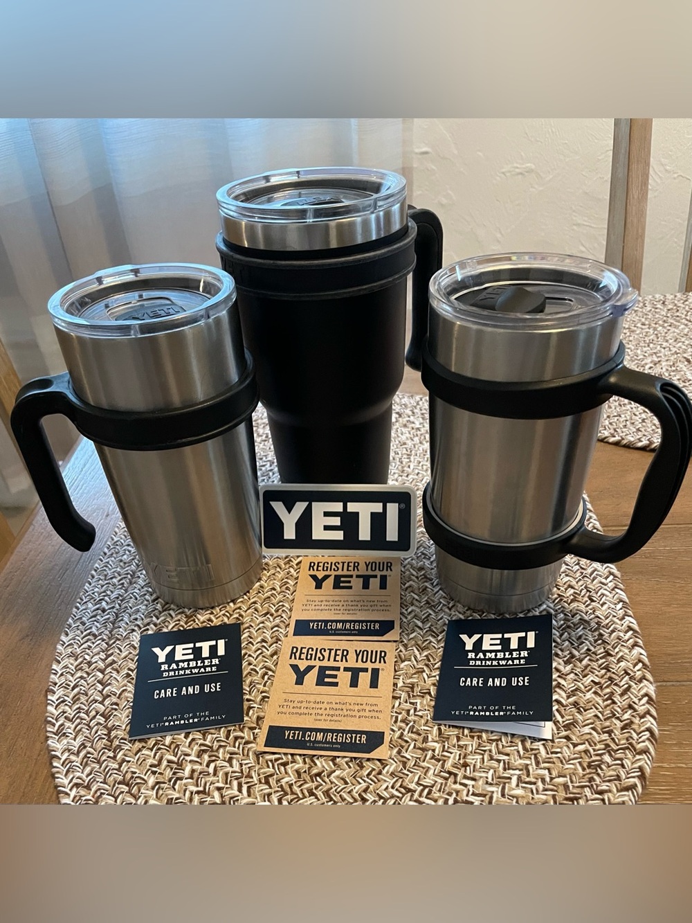 3 Yeti Stainless Steel Travel Mugs with Black Handles and Lids